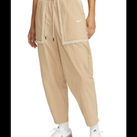 NIKE Women's Sportswear Essential Woven High-Waisted Curve Pants. Tan/cream. XS - Picture 1 of 14